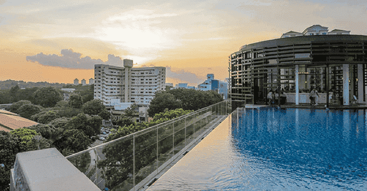 Taking a dip in the infinity pool at Park Hotel Alexandra
