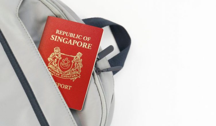 Singapore passport partially outside the bag