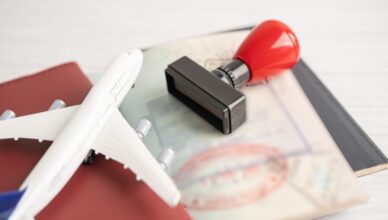 Passport and stamp on table with airoplane toy