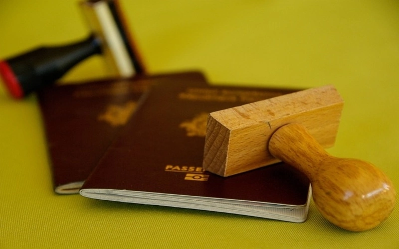 Visa travel documents with stamps on table 