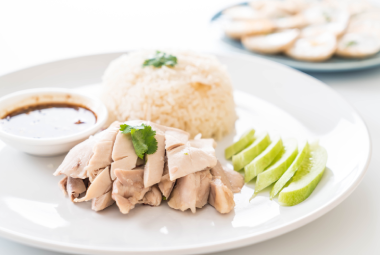 Hainanese Chicken Rice with cucumber and dark sauce